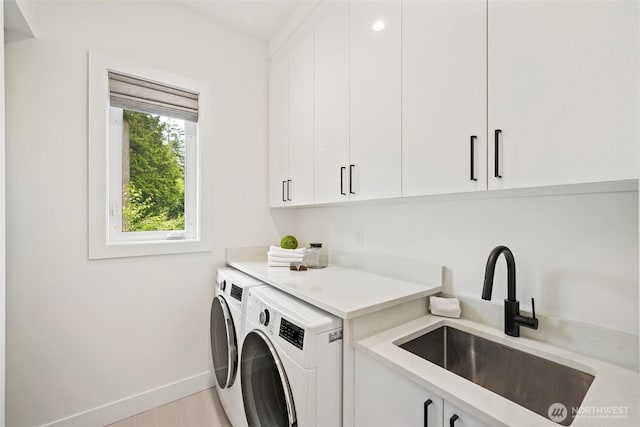 9051 Sea Mist Ln, Blaine, WA 98230 - laundry room featuring washer and dryer and cabinet space