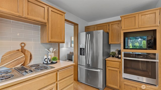 12607 SE 255th Pl, Kent, WA 98030 - kitchen with stainless steel appliances, light countertops, and tasteful backsplash