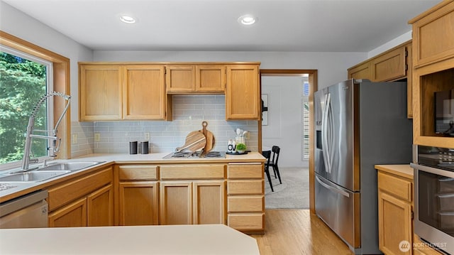 12607 SE 255th Pl, Kent, WA 98030 - kitchen featuring stainless steel appliances, light countertops, light wood-style flooring, tasteful backsplash, and recessed lighting