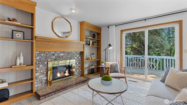 12607 SE 255th Pl, Kent, WA 98030 - living room featuring built in shelves, wood finished floors, and a fireplace