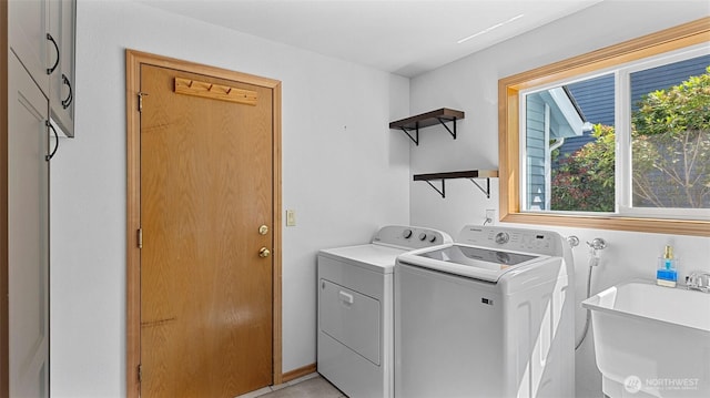 12607 SE 255th Pl, Kent, WA 98030 - laundry room featuring washer and clothes dryer and healthy amount of natural light