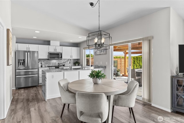 409 Davidson Blvd SW, Mattawa, WA 99349 - dining space with wood finished floors, a chandelier, and recessed lighting