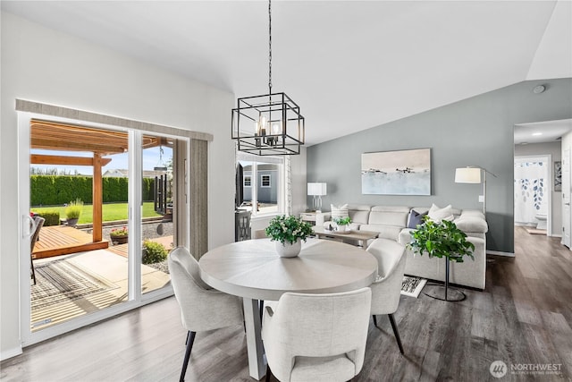 409 Davidson Blvd SW, Mattawa, WA 99349 - dining space with lofted ceiling, wood finished floors, and a chandelier