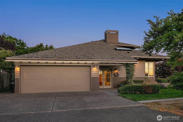2337 NW 194th Pl, Shoreline, WA 98177 - view of front of property with a chimney, asphalt driveway, roof with shingles, and an attached garage