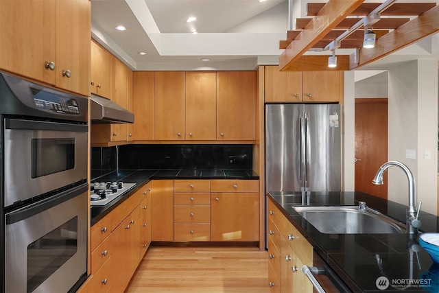 2337 NW 194th Pl, Shoreline, WA 98177 - kitchen with stainless steel appliances, light wood-style flooring, ventilation hood, decorative backsplash, and recessed lighting