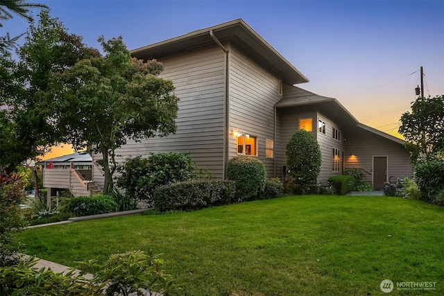 2337 NW 194th Pl, Shoreline, WA 98177 - property exterior at dusk with a lawn