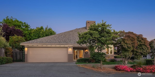 2337 NW 194th Pl, Shoreline, WA 98177 - view of front of house with driveway, a garage, roof with shingles, and a chimney