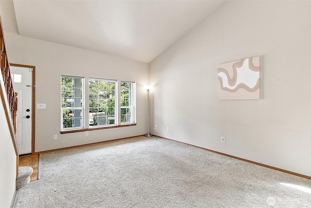 1810 S Tyler St, Tacoma, WA 98405 - spare room with lofted ceiling, stairs, and carpet flooring