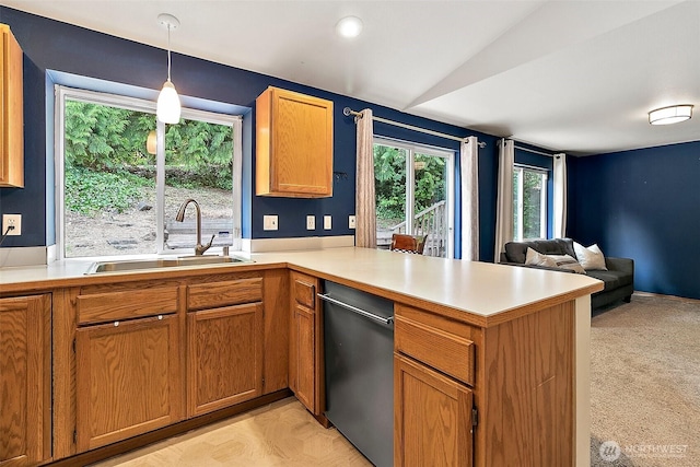 1810 S Tyler St, Tacoma, WA 98405 - kitchen featuring dishwashing machine, a peninsula, light countertops, open floor plan, and pendant lighting
