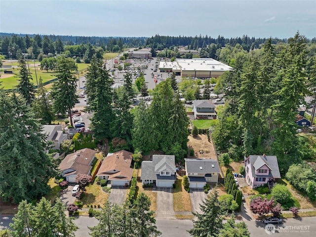 1810 S Tyler St, Tacoma, WA 98405 - aerial overview of property's location with nearby suburban area and a forest