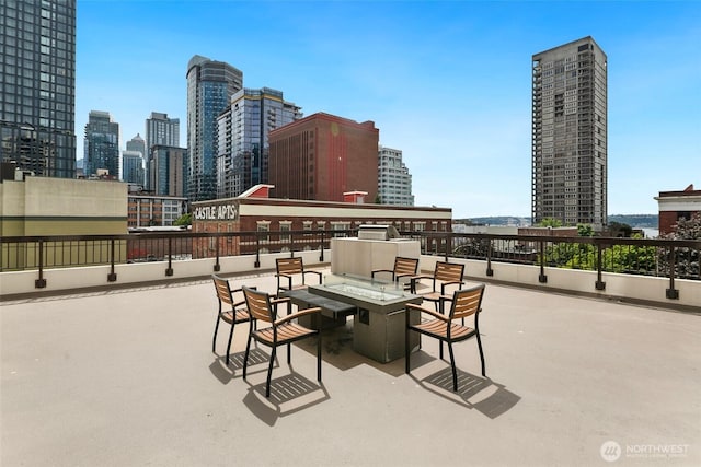 2201 3rd Ave Unit 1404, Seattle, WA 98121 - view of patio / terrace with a view of skyline and a fire pit