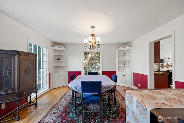 444 Washington St, Walla Walla, WA 99362 - dining room with healthy amount of natural light, a chandelier, and light wood-style floors