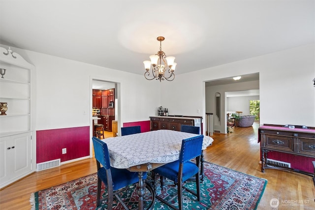 444 Washington St, Walla Walla, WA 99362 - dining area featuring wood finished floors and a chandelier