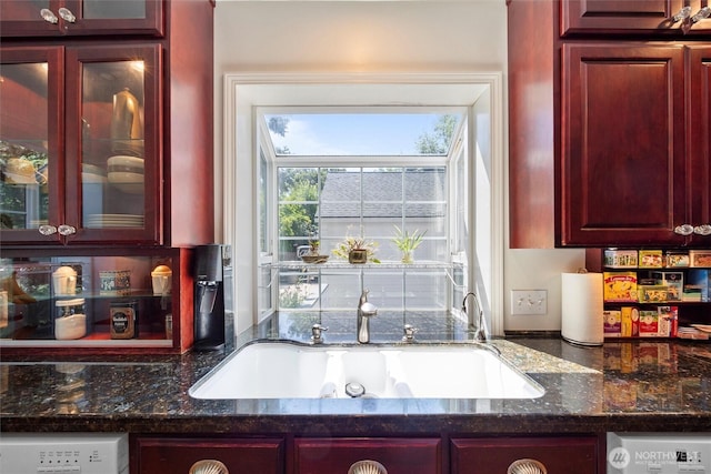 444 Washington St, Walla Walla, WA 99362 - kitchen with dark brown cabinets, dark stone countertops, and glass insert cabinets