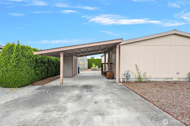 886 Carriage Ct, Sedro Woolley, WA 98284 - view of car parking with a storage shed, an attached carport, and driveway