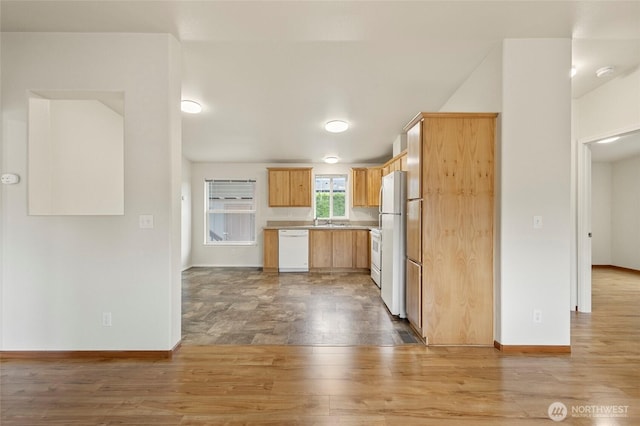 886 Carriage Ct, Sedro Woolley, WA 98284 - kitchen featuring white appliances, light wood-style flooring, light countertops, and light brown cabinetry