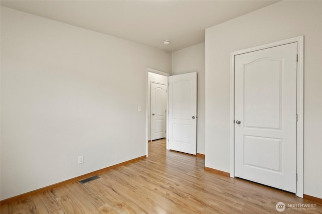 886 Carriage Ct, Sedro Woolley, WA 98284 - unfurnished bedroom with light wood-style flooring and baseboards
