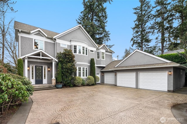 1510 38th Ave E, Seattle, WA 98112 - shingle-style home featuring curved driveway, a garage, and roof with shingles