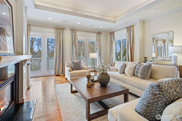 1510 38th Ave E, Seattle, WA 98112 - living area with plenty of natural light, a premium fireplace, crown molding, recessed lighting, and light wood-style floors