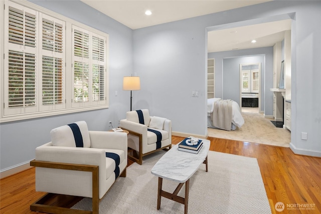 1510 38th Ave E, Seattle, WA 98112 - living area with light wood-style floors, recessed lighting, and a fireplace