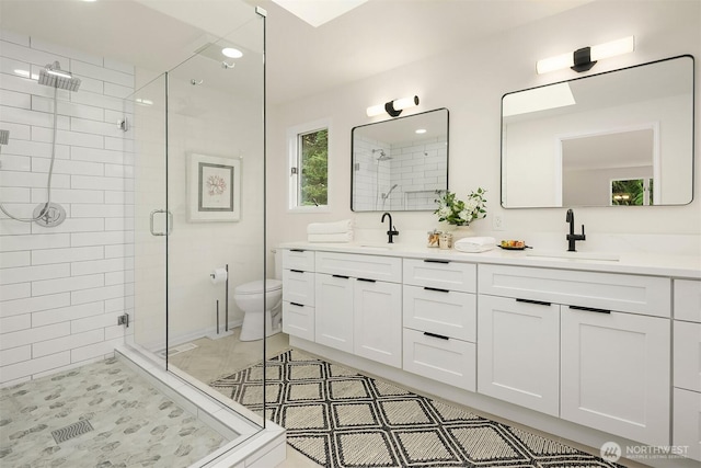 2534 Medina Cir, Medina, WA 98039 - full bath with a shower stall, double vanity, and recessed lighting