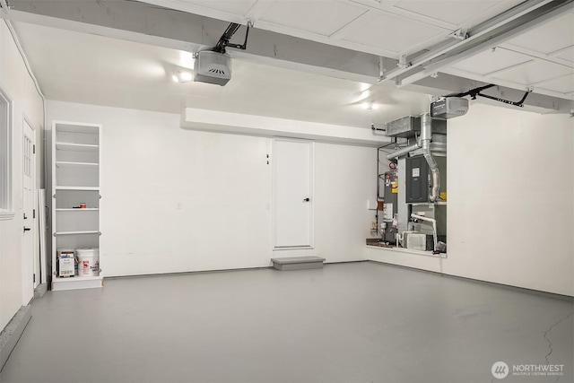 2534 Medina Cir, Medina, WA 98039 - garage featuring a garage door opener and gas water heater