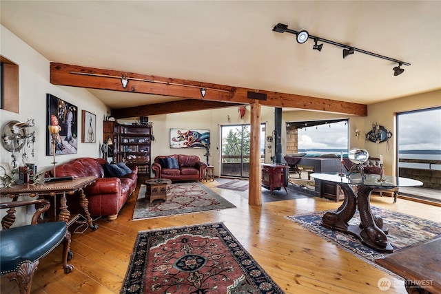 4722 53rd Ave SW, Seattle, WA 98116 - living room with beam ceiling, hardwood / wood-style floors, and track lighting
