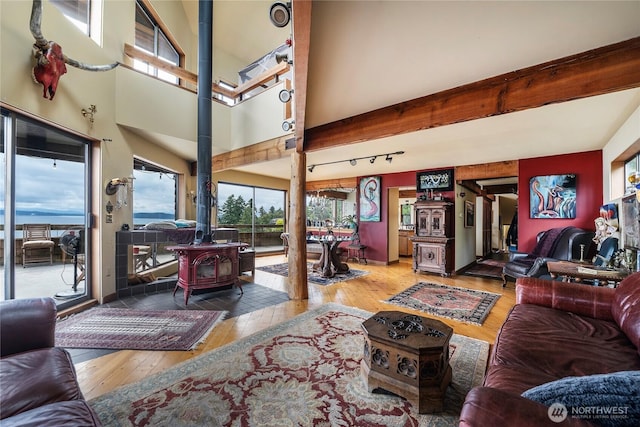 4722 53rd Ave SW, Seattle, WA 98116 - living room featuring a wood stove, hardwood / wood-style flooring, and beam ceiling