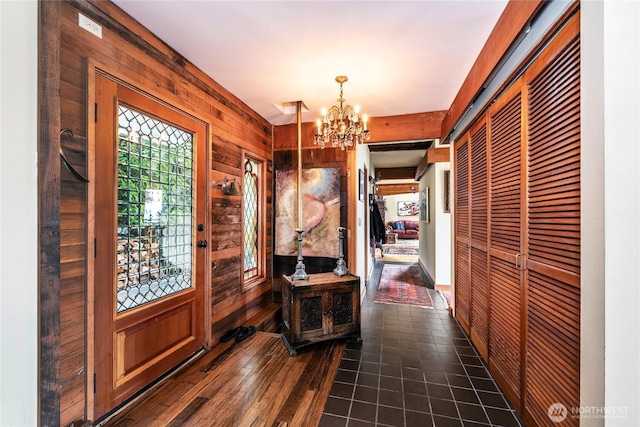 4722 53rd Ave SW, Seattle, WA 98116 - foyer featuring wooden walls and a chandelier