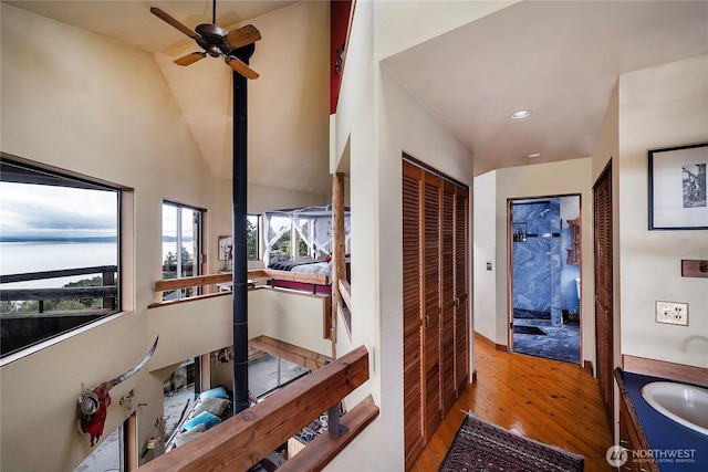 4722 53rd Ave SW, Seattle, WA 98116 - hall featuring hardwood / wood-style floors, recessed lighting, and high vaulted ceiling