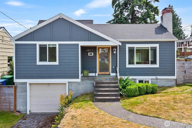 3017 Government Way, Seattle, WA 98199 - view of front of home with an attached garage, a chimney, a front lawn, and roof with shingles