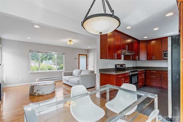 3017 Government Way, Seattle, WA 98199 - kitchen featuring stainless steel appliances, a baseboard radiator, under cabinet range hood, dark brown cabinets, and recessed lighting