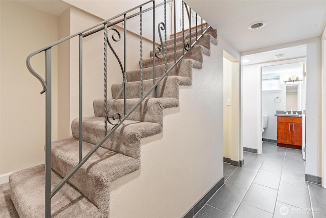 3017 Government Way, Seattle, WA 98199 - stairs featuring baseboards and tile patterned floors