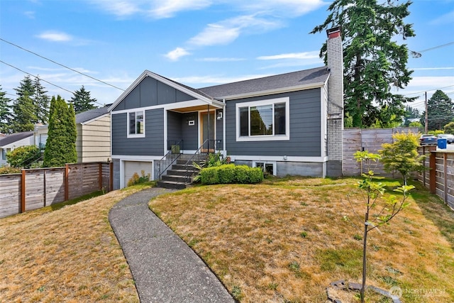 3017 Government Way, Seattle, WA 98199 - view of front of property featuring a chimney, a garage, a fenced backyard, and board and batten siding