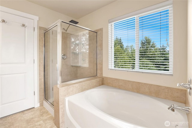 33908 12th Pl SW, Federal Way, WA 98023 - bathroom featuring a bath, a stall shower, and tile patterned flooring