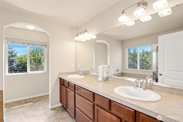 33908 12th Pl SW, Federal Way, WA 98023 - bathroom with double vanity, a bath, and an enclosed shower