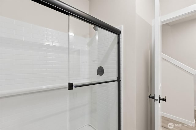 16723 Alderwood Mall Pkwy Unit C6, Lynnwood, WA 98037 - full bathroom with a tile shower and wood finished floors
