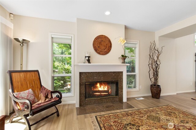 11211 NE 106th Pl, Kirkland, WA 98033 - living area with wood finished floors, a fireplace, and recessed lighting