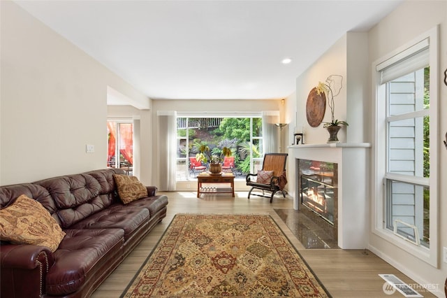 11211 NE 106th Pl, Kirkland, WA 98033 - living room featuring wood finished floors, a fireplace, and recessed lighting
