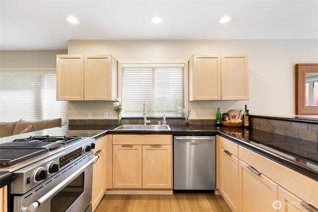 11211 NE 106th Pl, Kirkland, WA 98033 - kitchen featuring stainless steel appliances, light brown cabinets, healthy amount of natural light, a peninsula, and recessed lighting