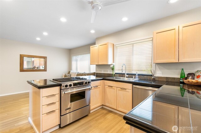 11211 NE 106th Pl, Kirkland, WA 98033 - kitchen featuring stainless steel appliances, light brown cabinets, a peninsula, light wood-type flooring, and recessed lighting