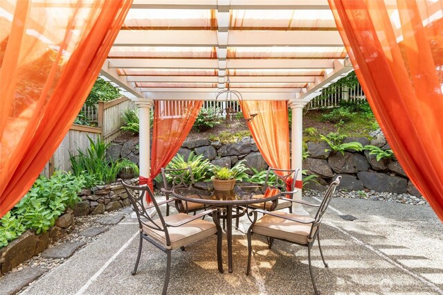 11211 NE 106th Pl, Kirkland, WA 98033 - fenced backyard with a patio, outdoor dining area, and a pergola