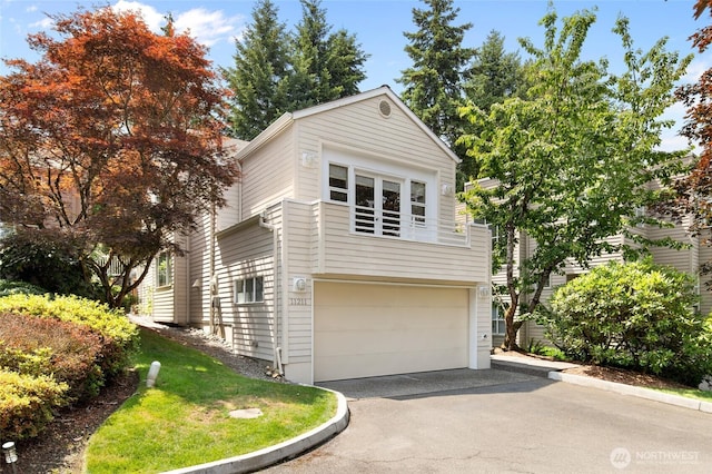 11211 NE 106th Pl, Kirkland, WA 98033 - view of front facade with asphalt driveway and an attached garage