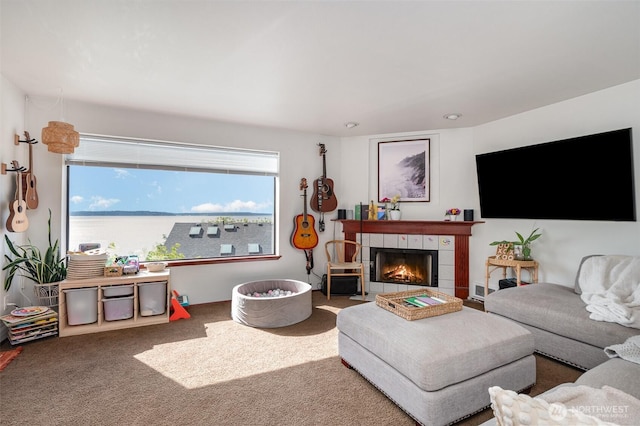 5310 SW College St, Seattle, WA 98116 - living room with a tiled fireplace, carpet, and healthy amount of natural light