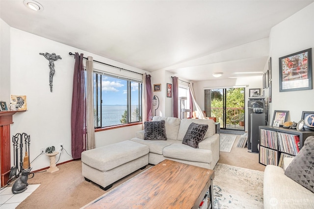 5310 SW College St, Seattle, WA 98116 - living room featuring carpet, lofted ceiling, and a water view