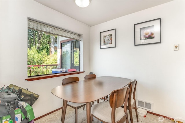5310 SW College St, Seattle, WA 98116 - dining area featuring baseboards and light tile patterned floors