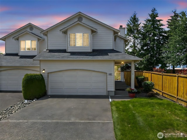 11008 36th Avenue Ct E, Tacoma, WA 98446 - traditional home with an attached garage, a chimney, and concrete driveway