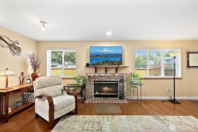 11008 36th Avenue Ct E, Tacoma, WA 98446 - living area featuring wood finished floors and a tiled fireplace