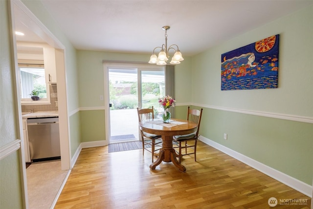 3024 Carpenter Loop SE, Olympia, WA 98503 - dining area with light wood-type flooring and a chandelier