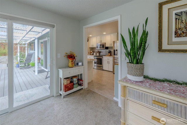 3024 Carpenter Loop SE, Olympia, WA 98503 - doorway to outside with a sunroom and light colored carpet